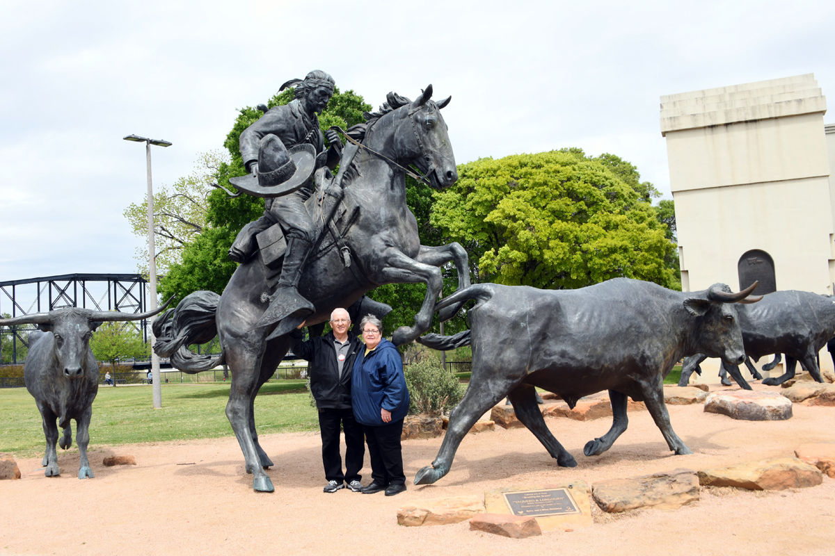 291 Doug and Missy Heiden at the Chisholm Trail commemorative bronze statues in Waco, Texas.JPG